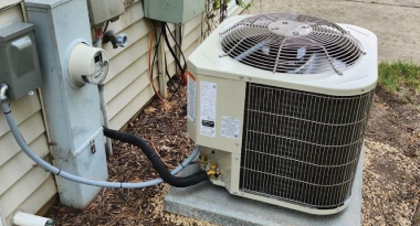 AC installation and air conditioner repair in Aurora, IL - Youngren's HVAC technician servicing central air unit